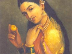 A Lady holding a Fruit